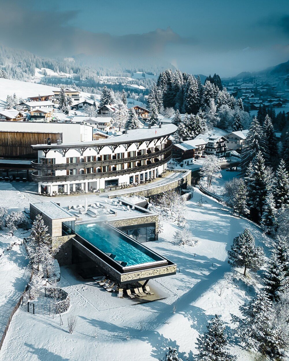 Snow-covered alpine resort building in the Kleinwalsertal valley