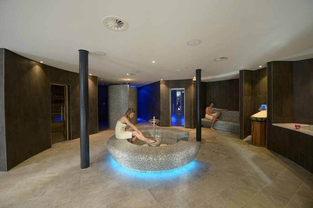 Modern spa area with relaxation loungers and soft lighting