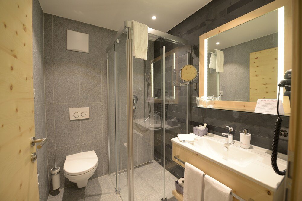 Modern bathroom with a shower and clean white fittings
