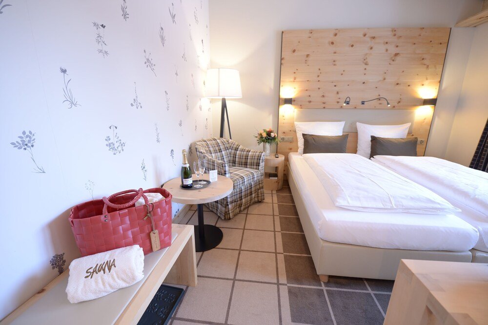 Hotel room with a large bed and warm lighting