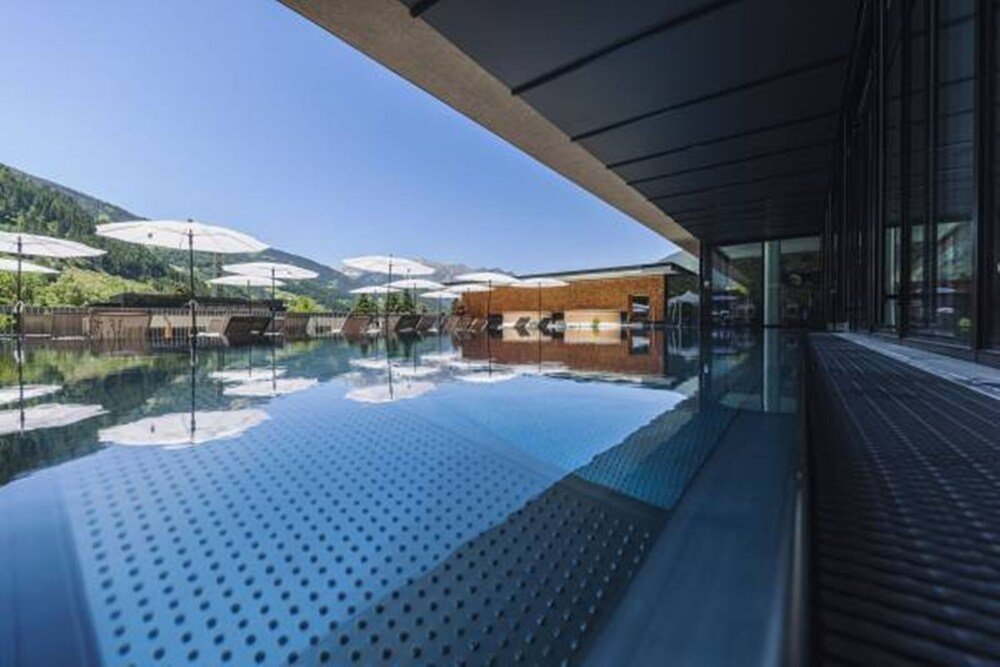 Infinity pool with a view of the surrounding mountains