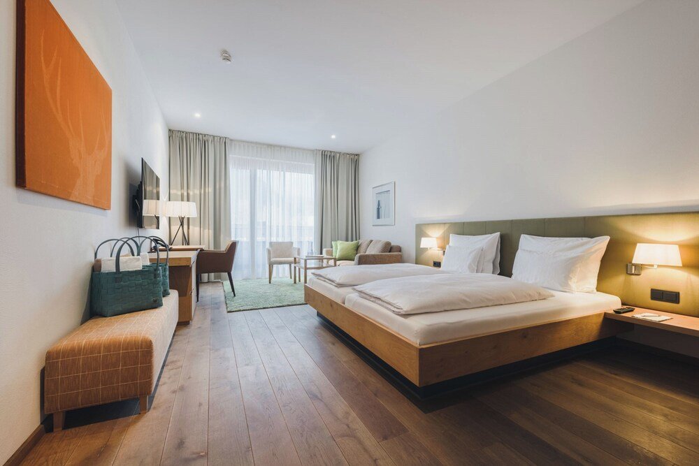 Hotel room with a large bed and neutral colours