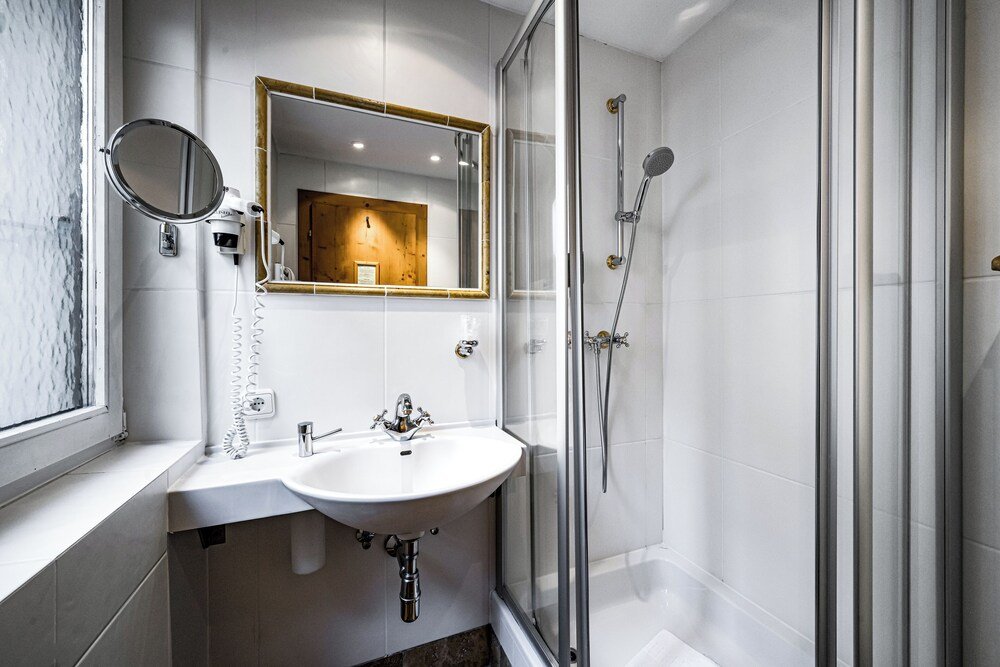 Modern bathroom in a guest room at Alpina