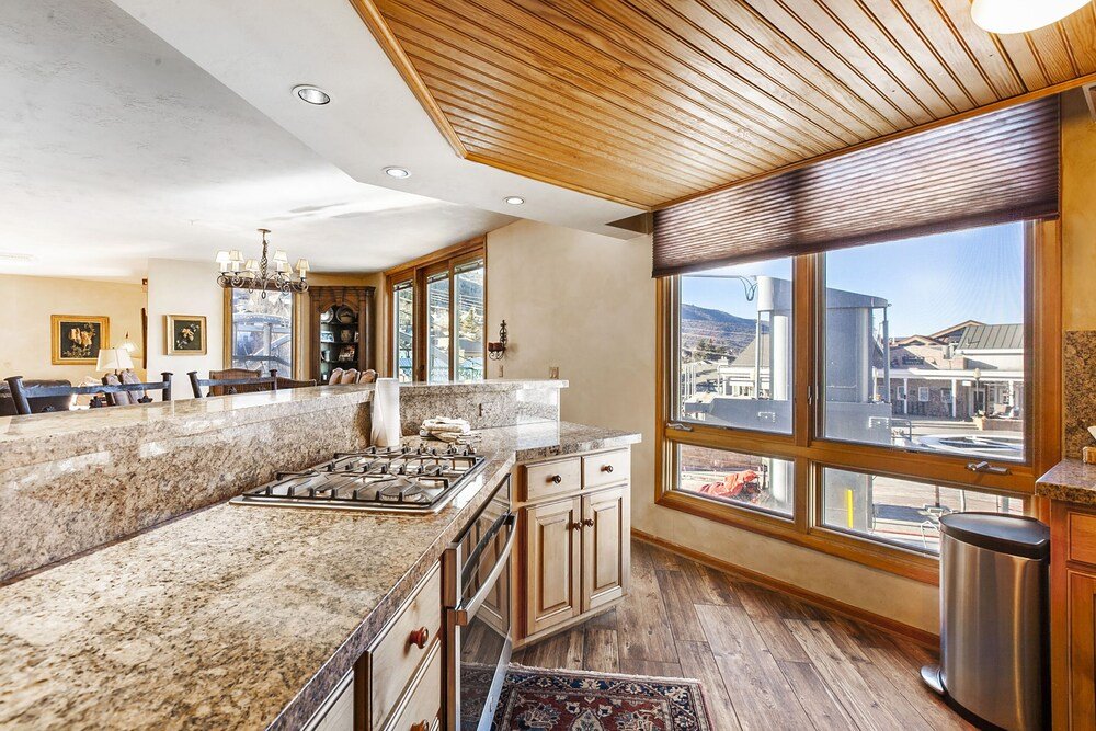 Kitchen with a large island in a Caledonian unit