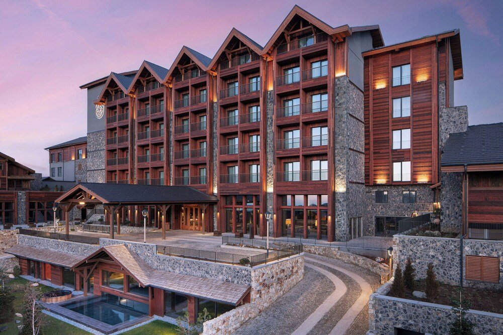 Multi-story hotel with a stone facade