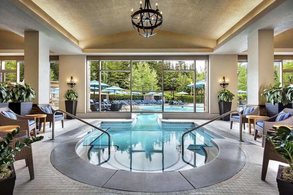 Pool area with lounge chairs at the Whistler resort