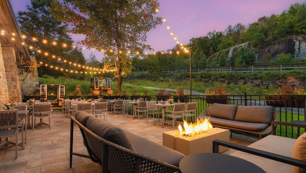Outdoor patio with tables at the Mont-Tremblant resort
