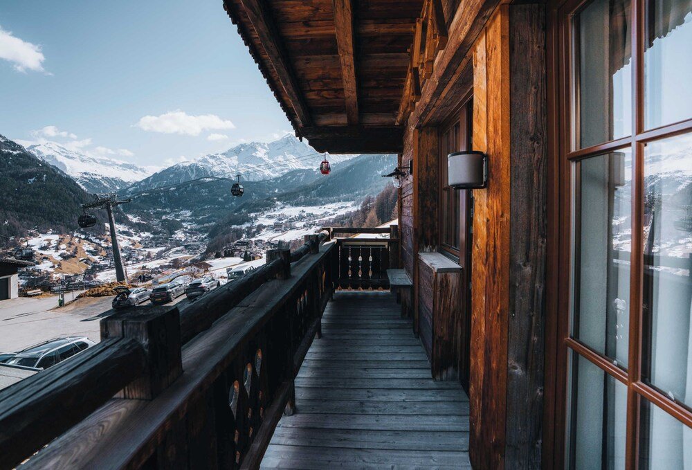 Wooden balcony of the hotel in the Alps