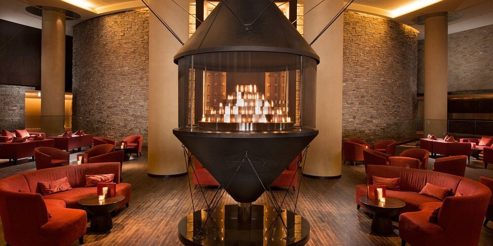 Lobby with a central fireplace at the Niseko resort