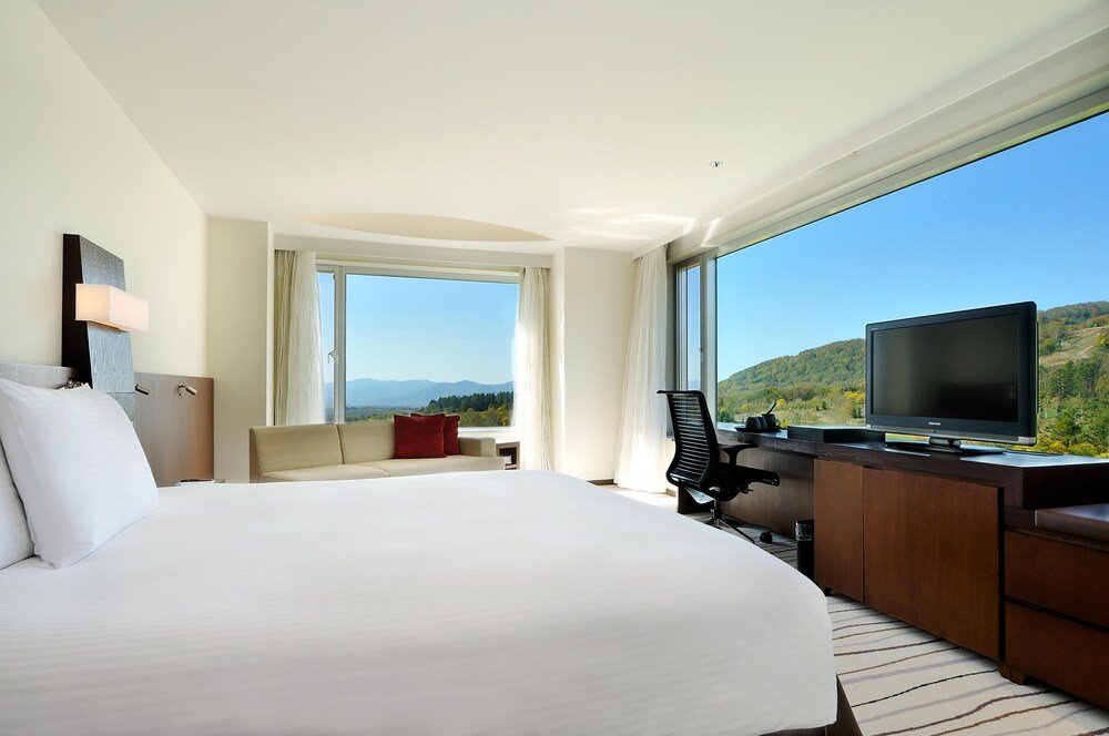 Hotel room with a large bed at Hilton Niseko Village