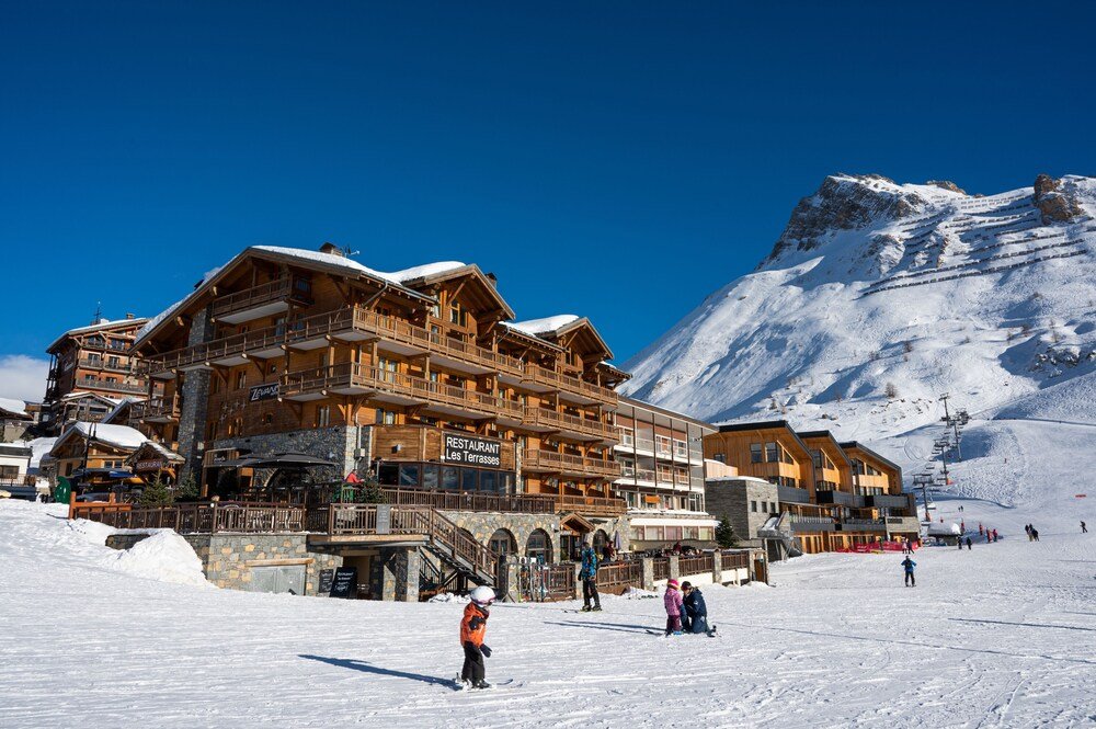 Large wooden hotel building in a mountain village