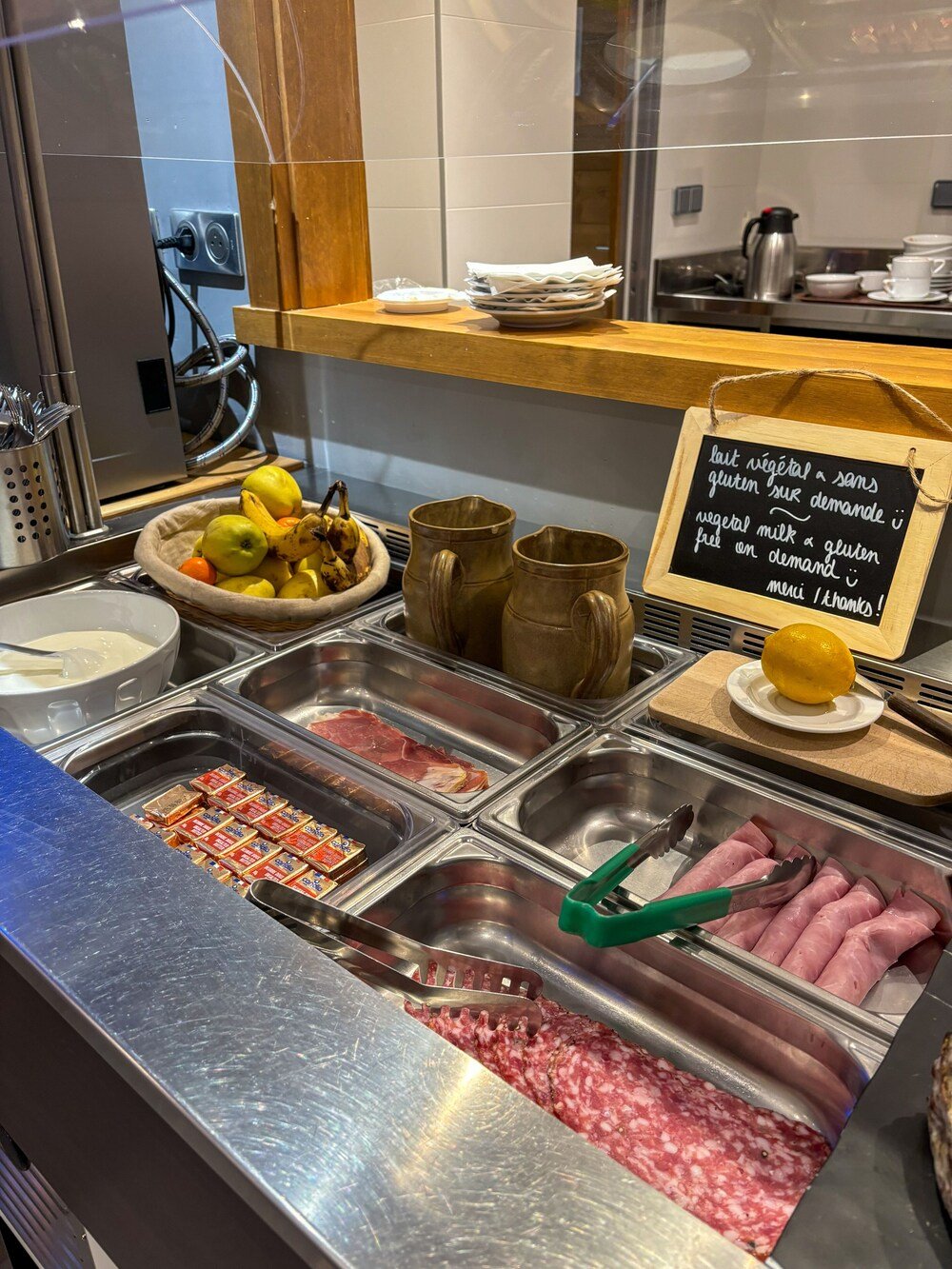 Breakfast buffet with food laid out on tables