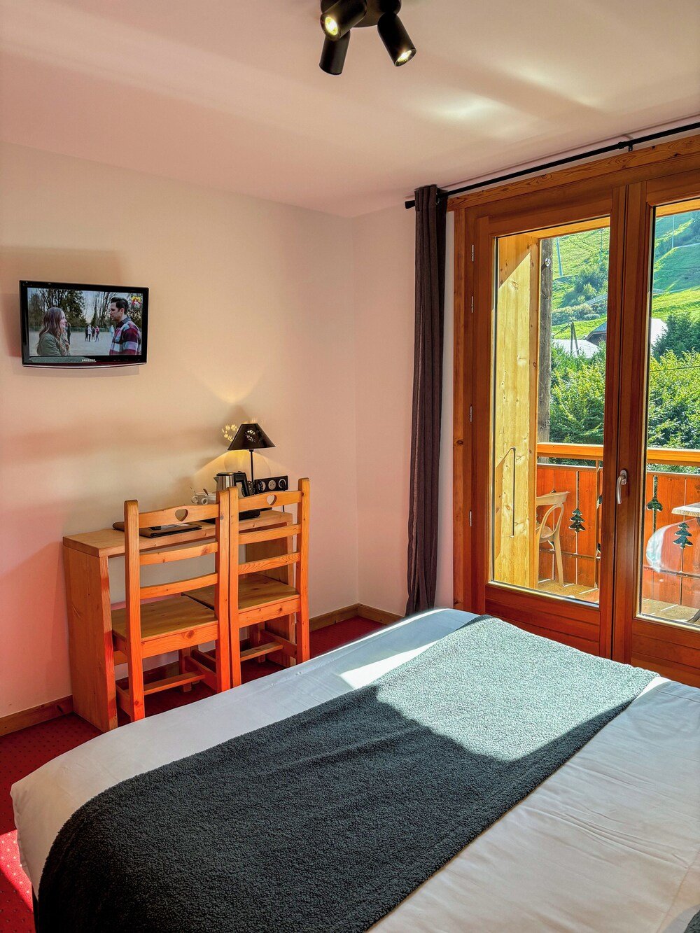Comfortable hotel bedroom with a large bed