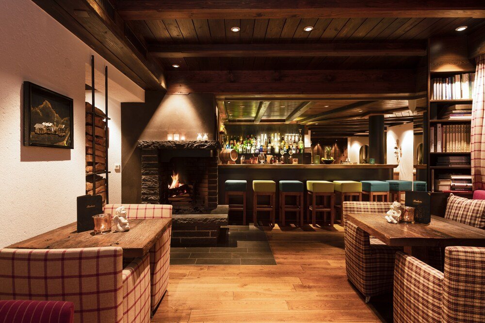 Cozy bar area with seating at Hotel Sandhof in Lech