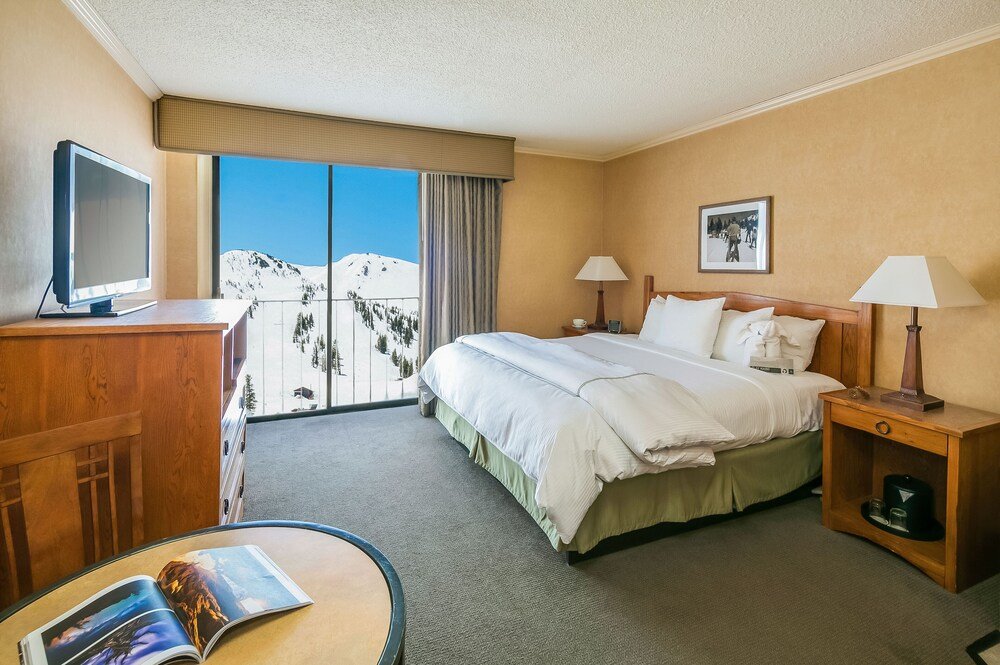 Hotel room with a bed at Mammoth Mountain Inn
