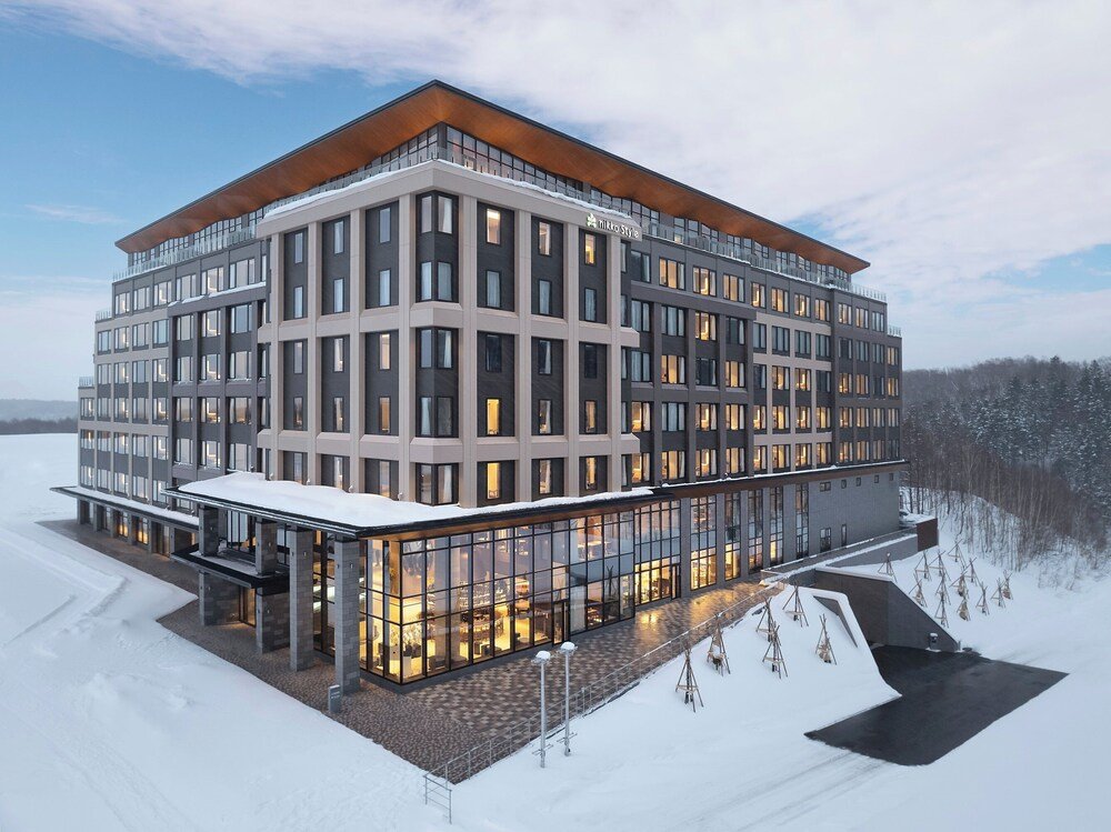 Modern multi-story hotel with a glass facade