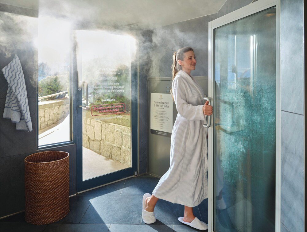 Person in a white robe at the hotel in Whistler