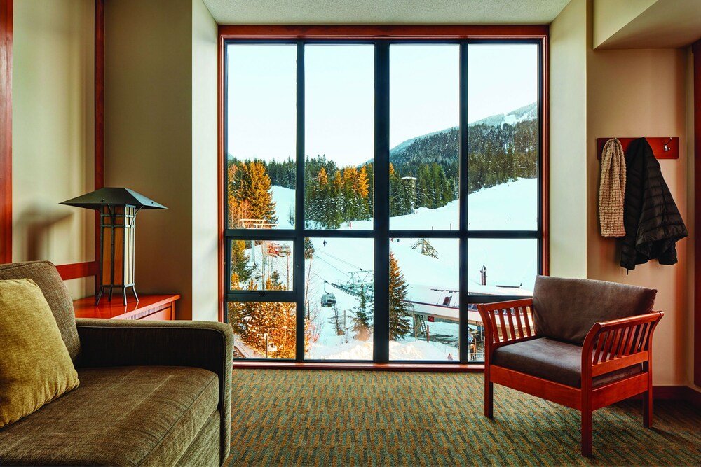 Guest room with a large window at the Whistler hotel