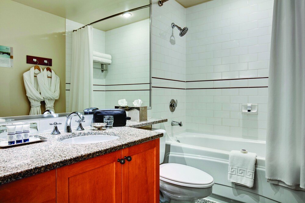 Bathroom with a granite countertop at Pan Pacific Whistler