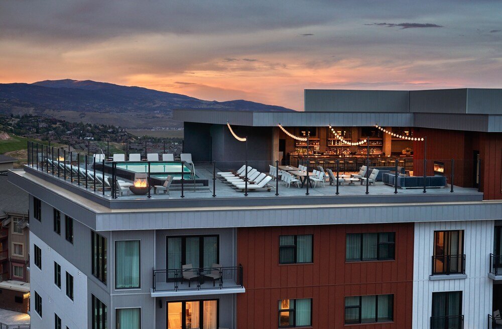 Rooftop bar with comfortable lounge seating at Pendry Park City