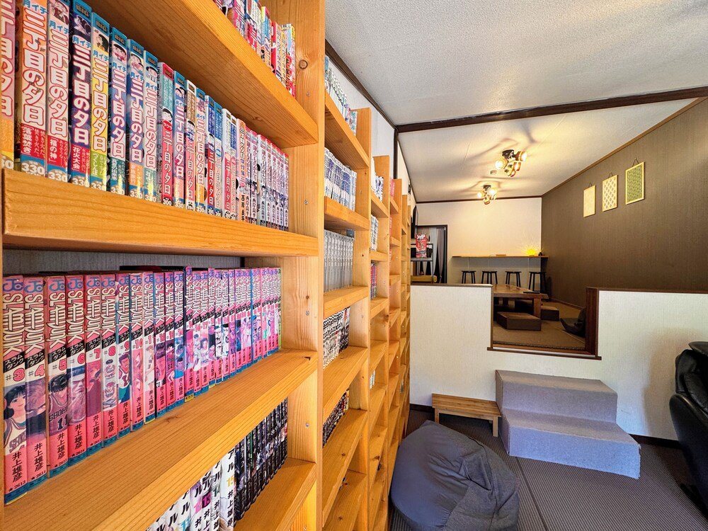 Room with wooden shelves full of manga books