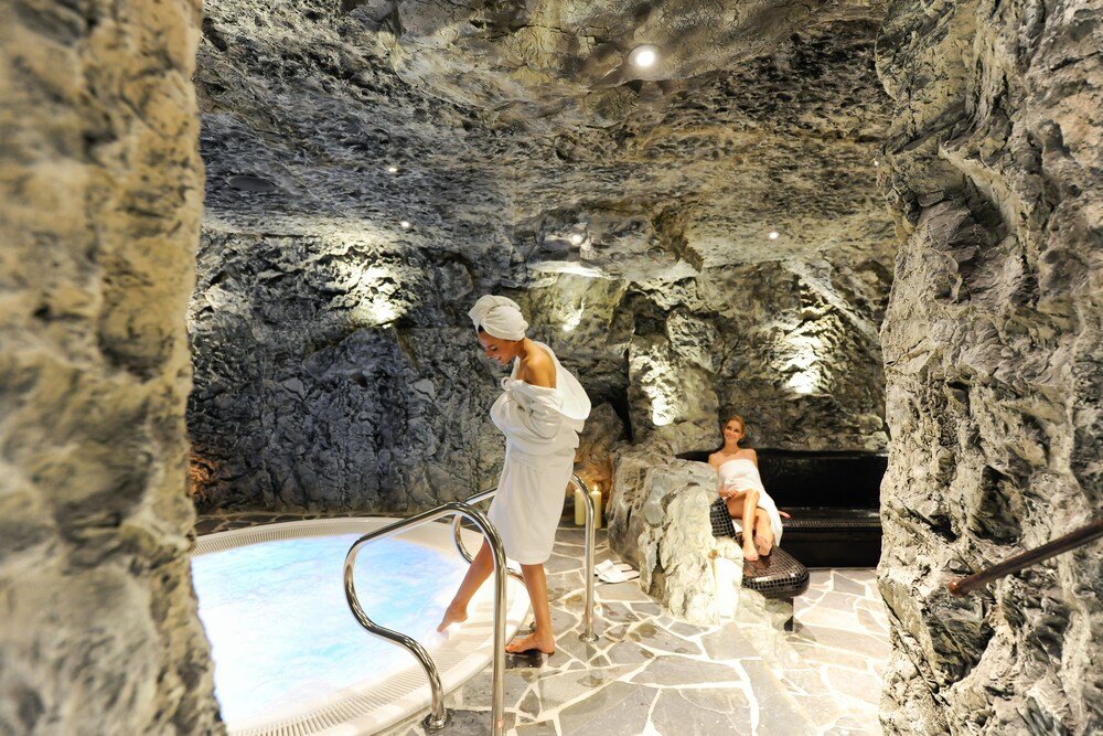 Spa area with a stone feature at Chasa Montana in Samnaun