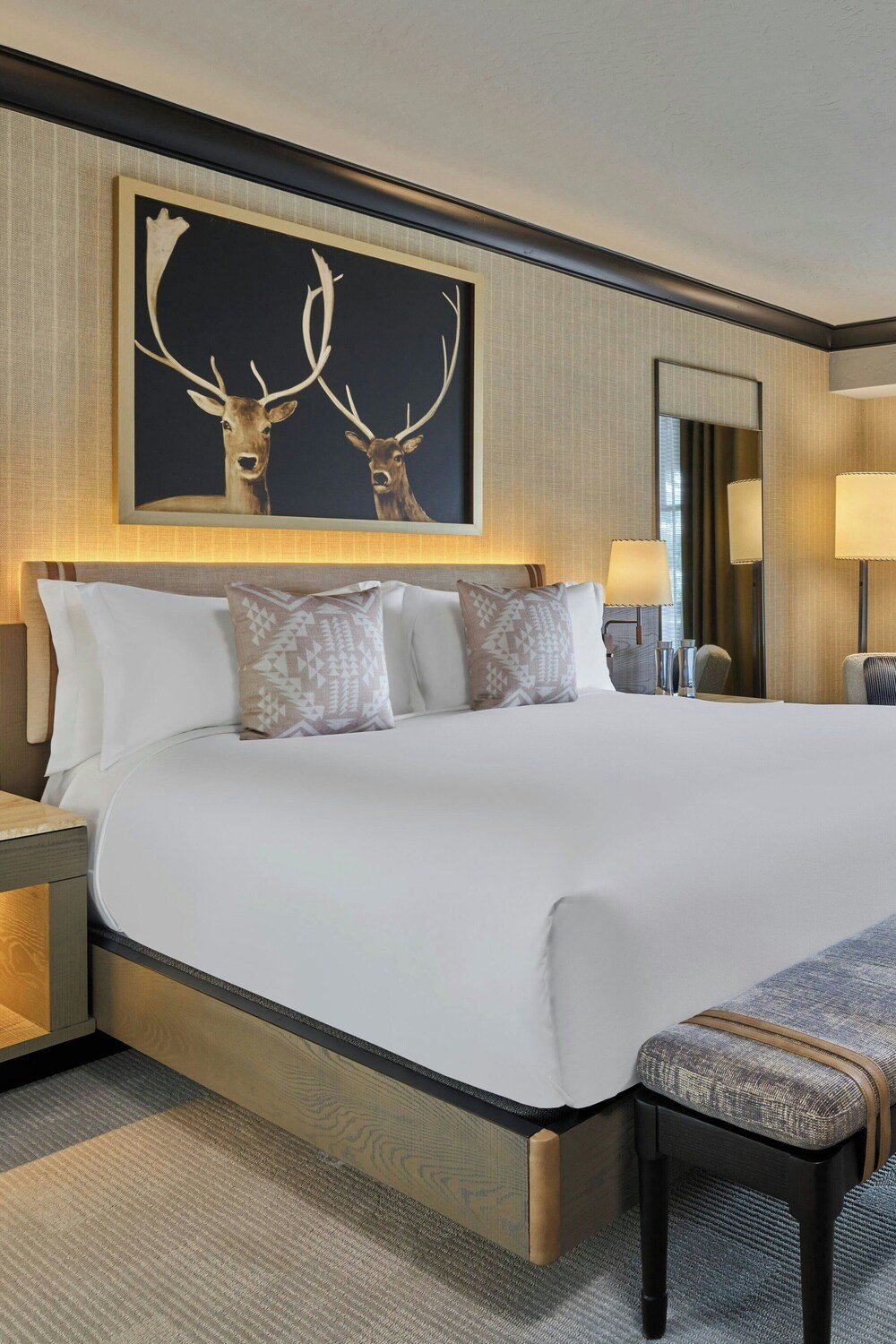 Large bed with a headboard at The Ritz-Carlton Bachelor Gulch