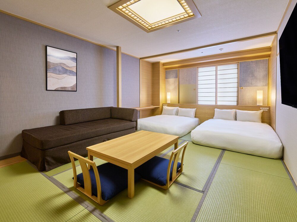 Room with a sofa and a bed
