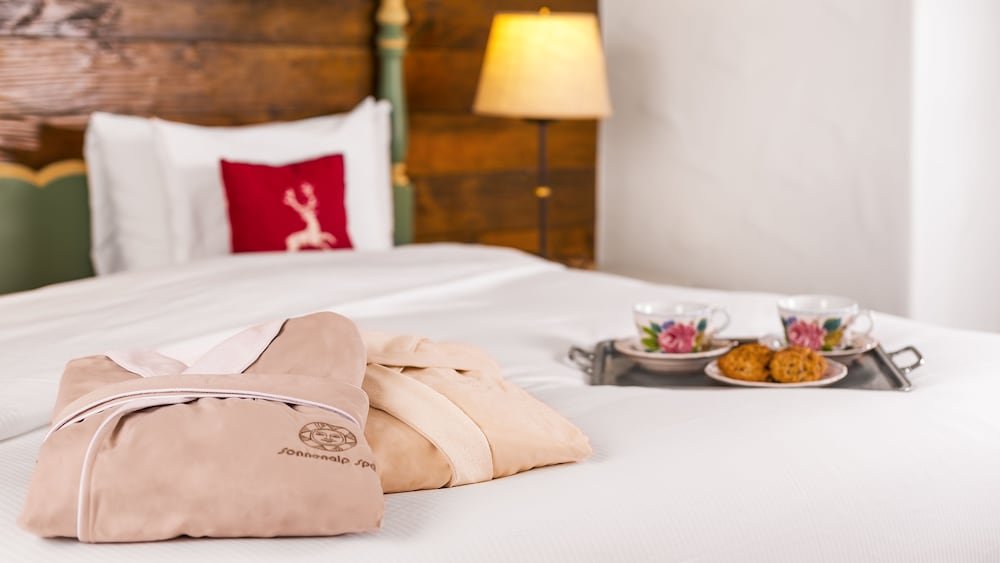Neatly made bed in a hotel room