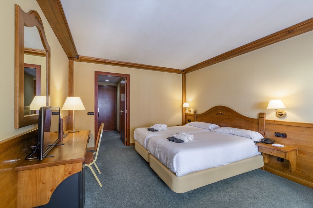 Hotel room with a bed at Sport Village in Soldeu