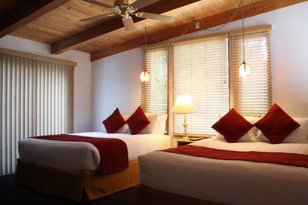 Guest room with beds and simple furnishings