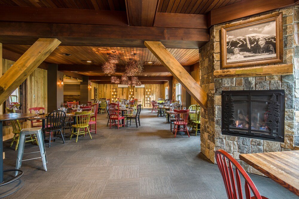 Spacious dining area with tables and large windows