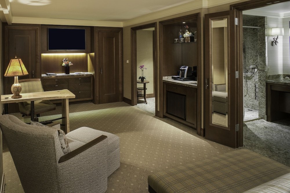 Guest room with a bed and a seating area