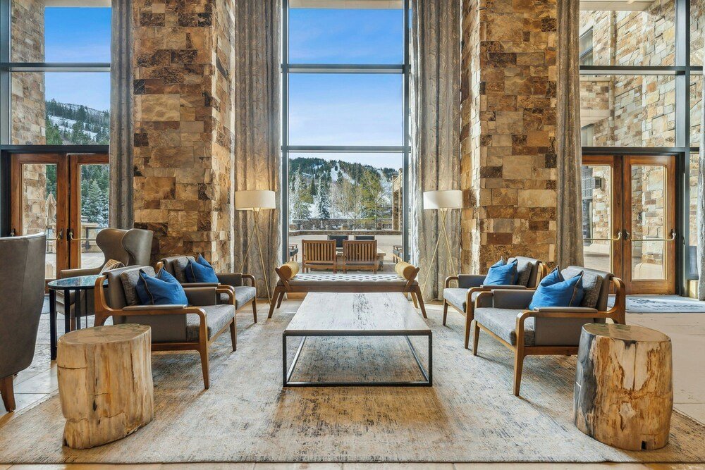 Spacious lobby with stone walls and large windows
