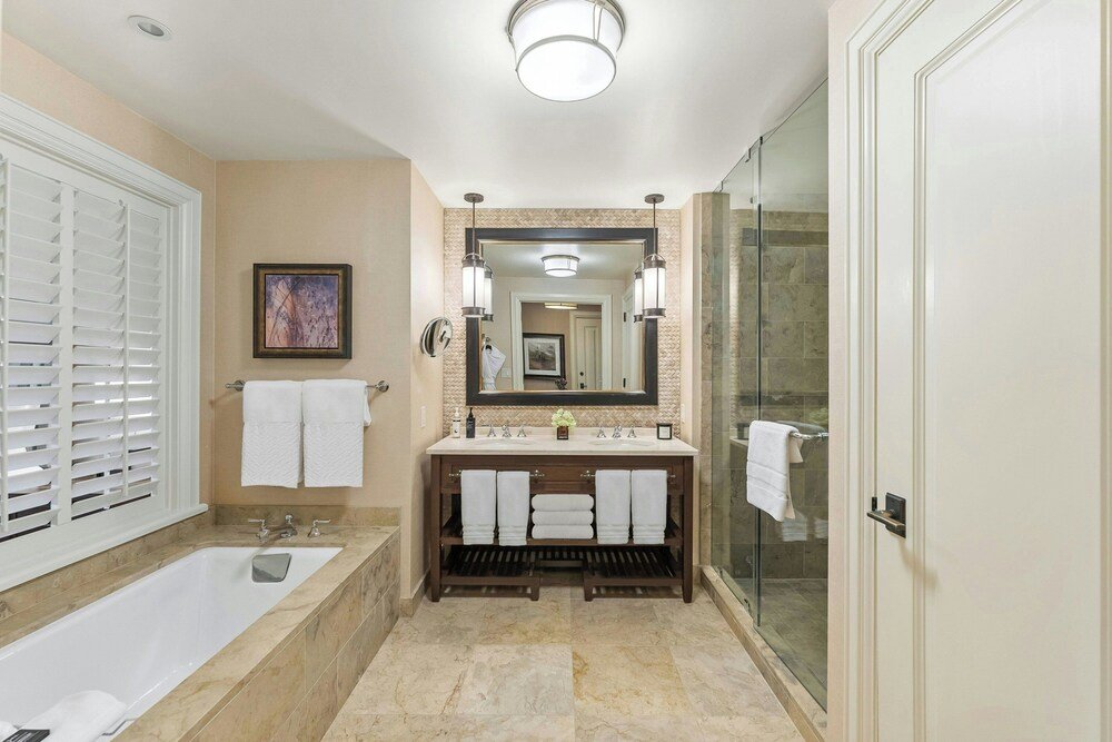 Modern bathroom with bathtub and glass shower