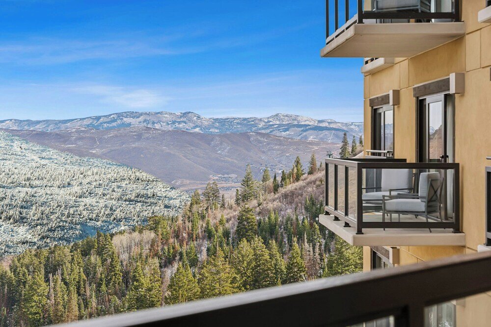 Modern building with a balcony overlooking mountains