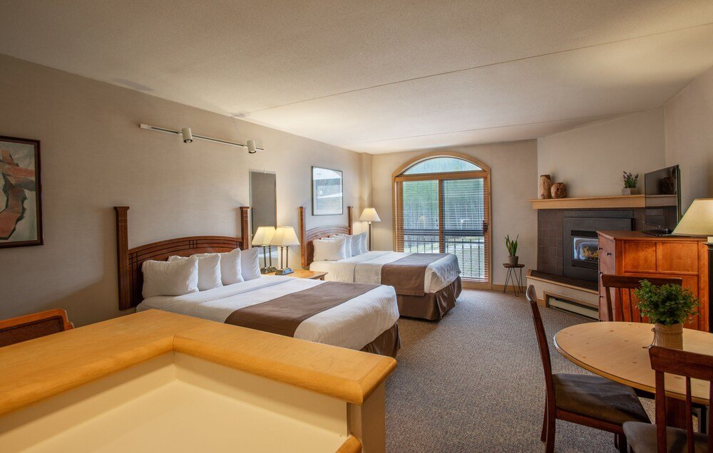 Hotel room with beds and simple furnishings