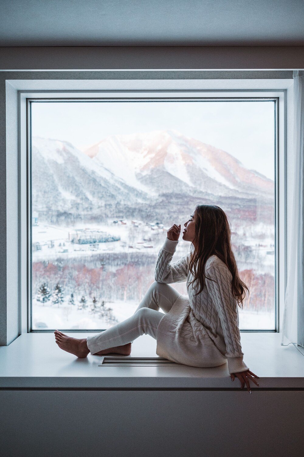 Window with a snowy mountain view